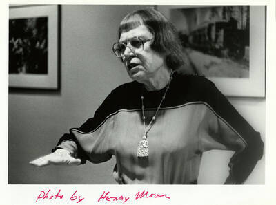 A woman talking and moving her hand. Caption on the back: ""Hazel Banner.""