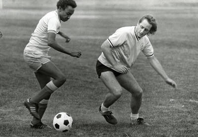 Students playing soccer.