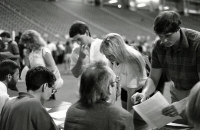 Students being helped with registering for classes in the Kibbie Dome.