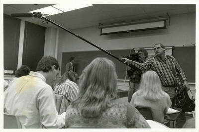 Film crew record students in a classroom.