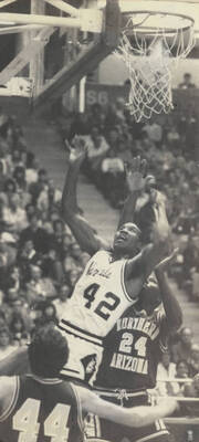 Vandals basketball player Freeman Watkins (42) reaching for the rebound in a game against the Northern Arizona Lumberjacks.
