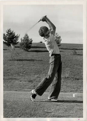 U of I Golf Course. Man golfing.