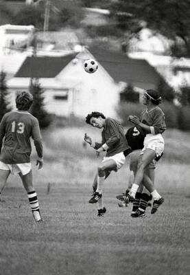 Students playing soccer.