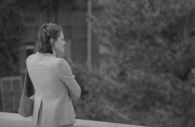 A woman looking out over campus.