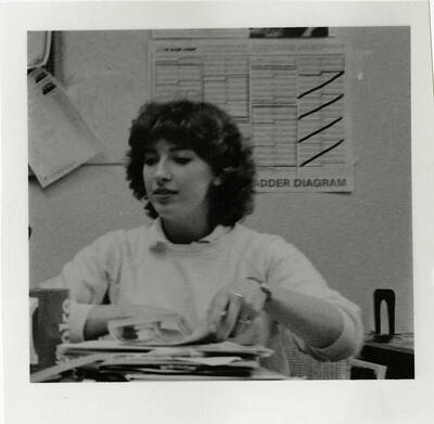 Student working on newspaper.