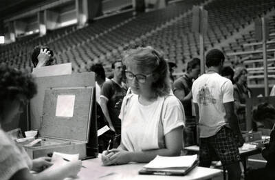 A student registering for classes in the Kibbie Dome.