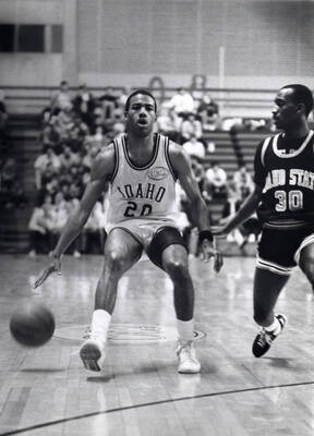 Idaho Caesar Prelow dribbles up the court against an ISU defender.