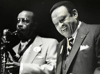 Lionel Hampton playing his vibraphone along with a saxophonist.