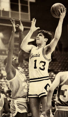 Tom Stalick (13) jumping up for a shot.