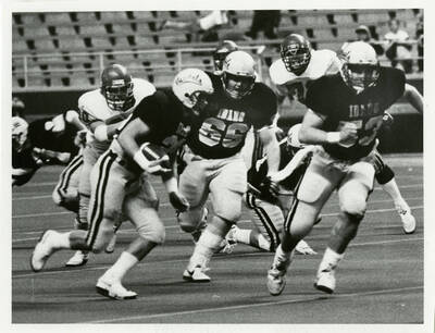 Idaho football player running the ball.