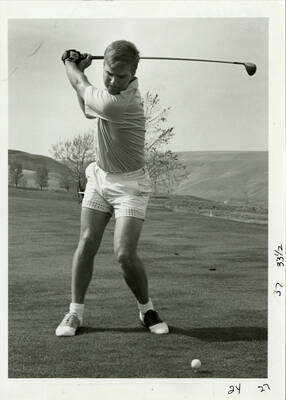 U of I Golf Course. Man golfing.