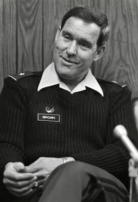 An armed forces official identified on name tag as 'Brown.'