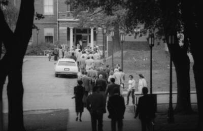 People walking into a building on campus.
