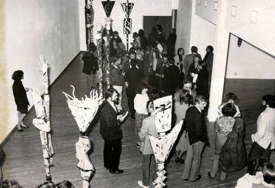 Art enthusiasts gathering to look at various creations during the opening of the Prichard Art Gallery in Downtown Moscow.