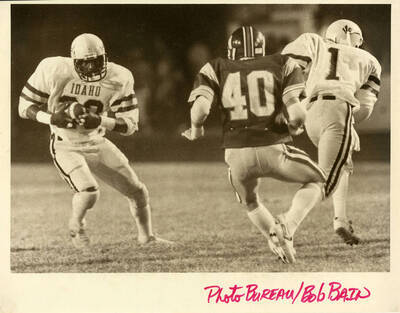 Idaho football player running the ball.
