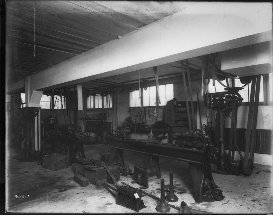 Interior of Hendricks Garage shows equipment for working on automobiles.