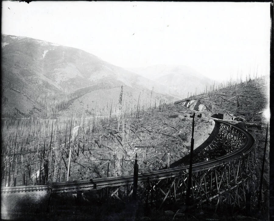 Image shows a railroad track going toward a mine in the Stevens Peak region.