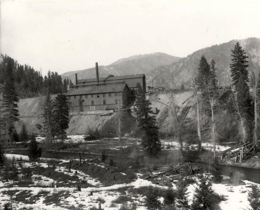 Creek and buildings on the hillside at the Amador Mine in Cedar Creek, Montana.
