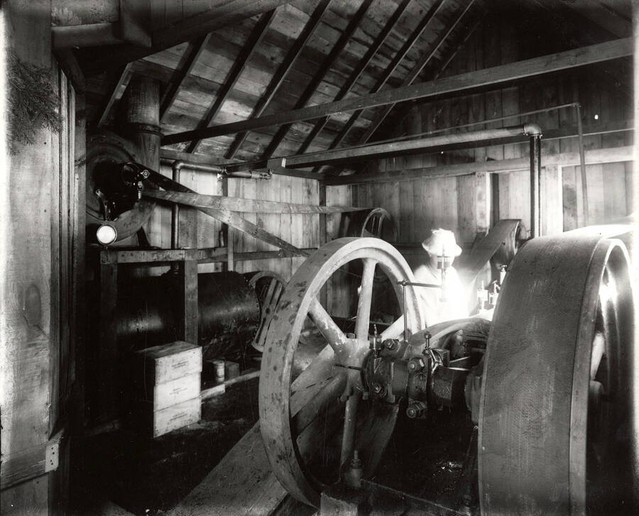 A man standing in the power plant on Hector Mine.