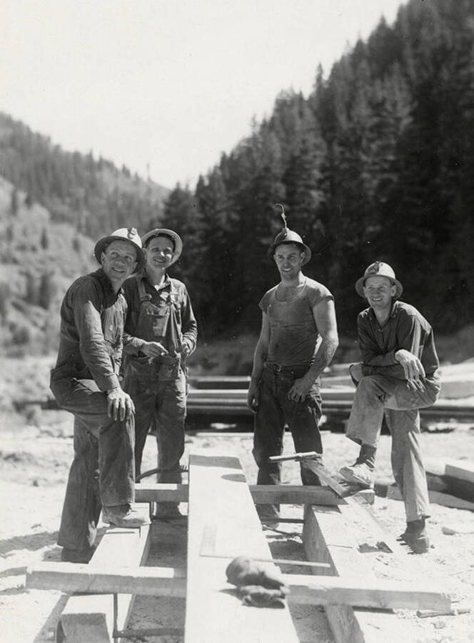 Men building a frame for a loading device at the mine on Rock Creek, west of Mullan, Idaho.