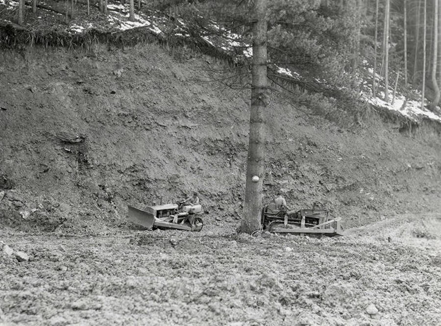 Men working with bulldozers at the mine on Rock Creek, west of Mullan, Idaho.