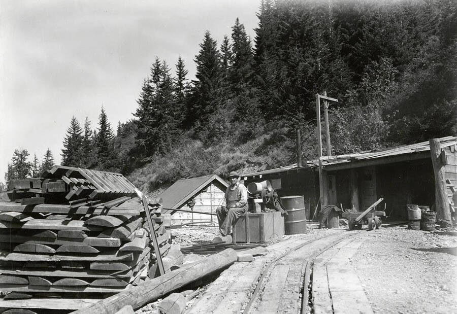 Exterior view of Parrot Lease. A man can be seen sitting on some of the equipment.