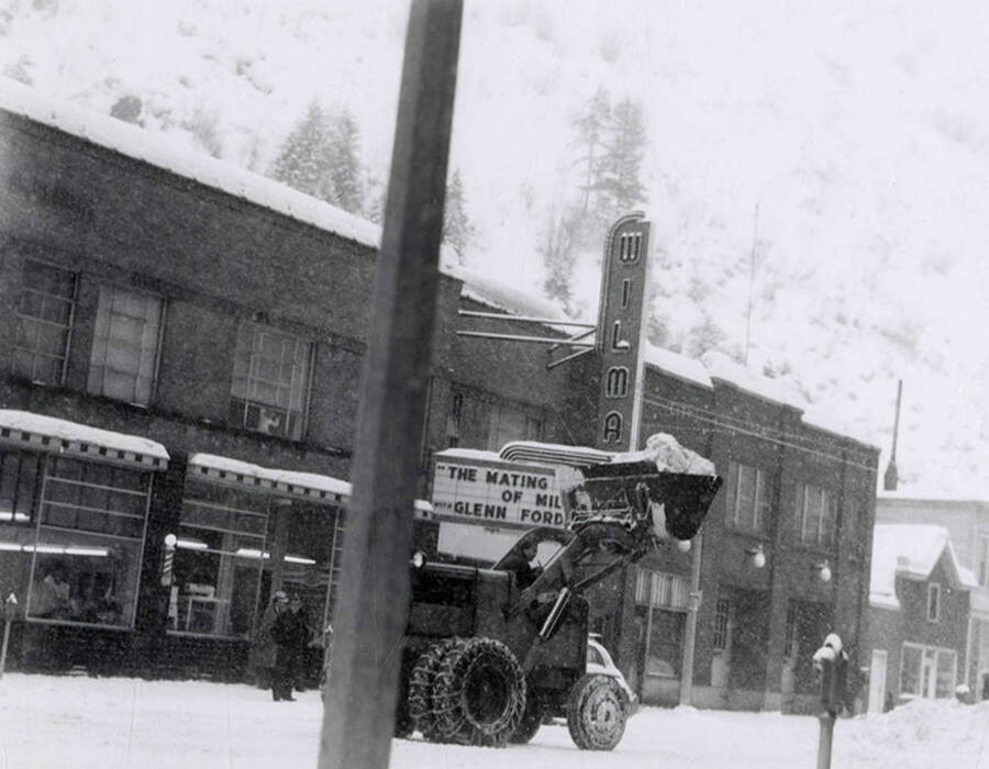 Clearing snow from the street in front of Wilma Theatre in Wallace, Idaho.