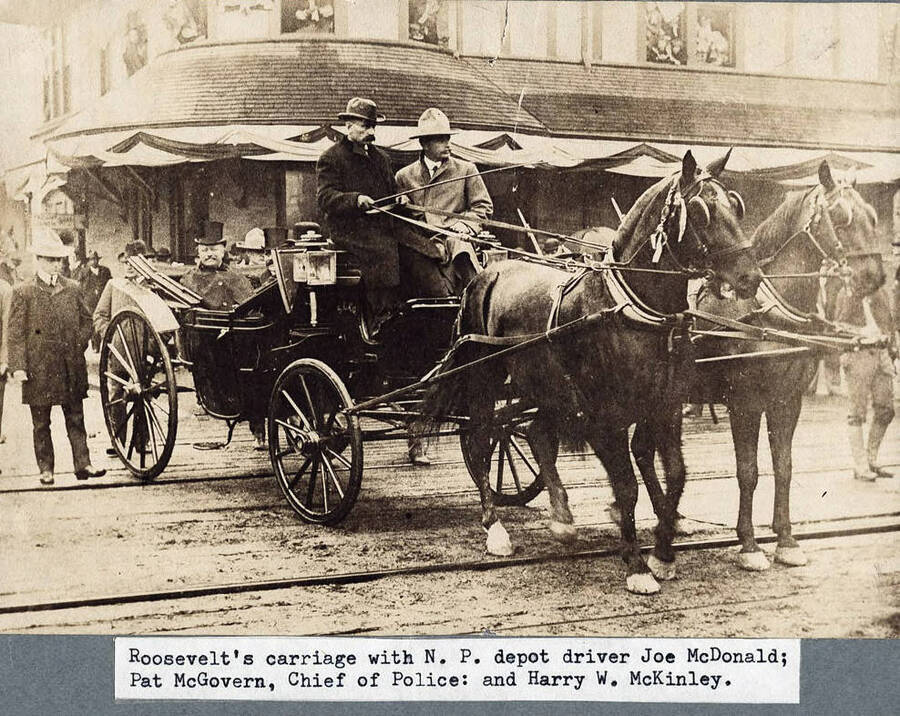 A close-up image of President Theodore Roosevelt. He is seen riding in a carriage, during a visit to Wallace, Idaho.