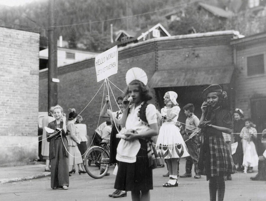 Children holding telephones during the Elks Roundup parade in Wallace, Idaho.