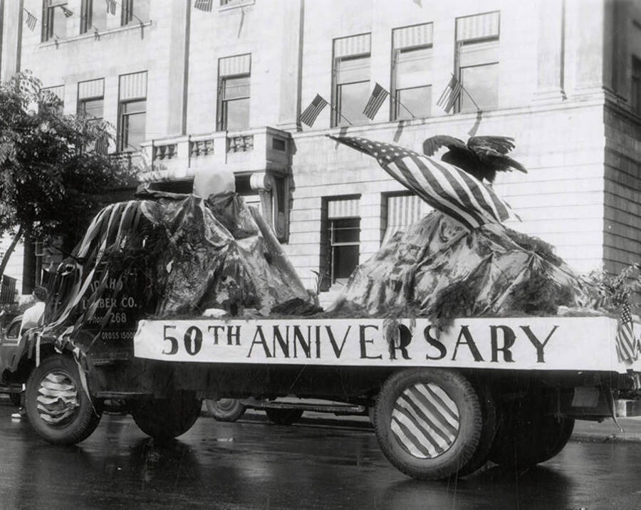 A float with "50th Anniversary" written on it driving in the Eagles parade in Wallace, Idaho.