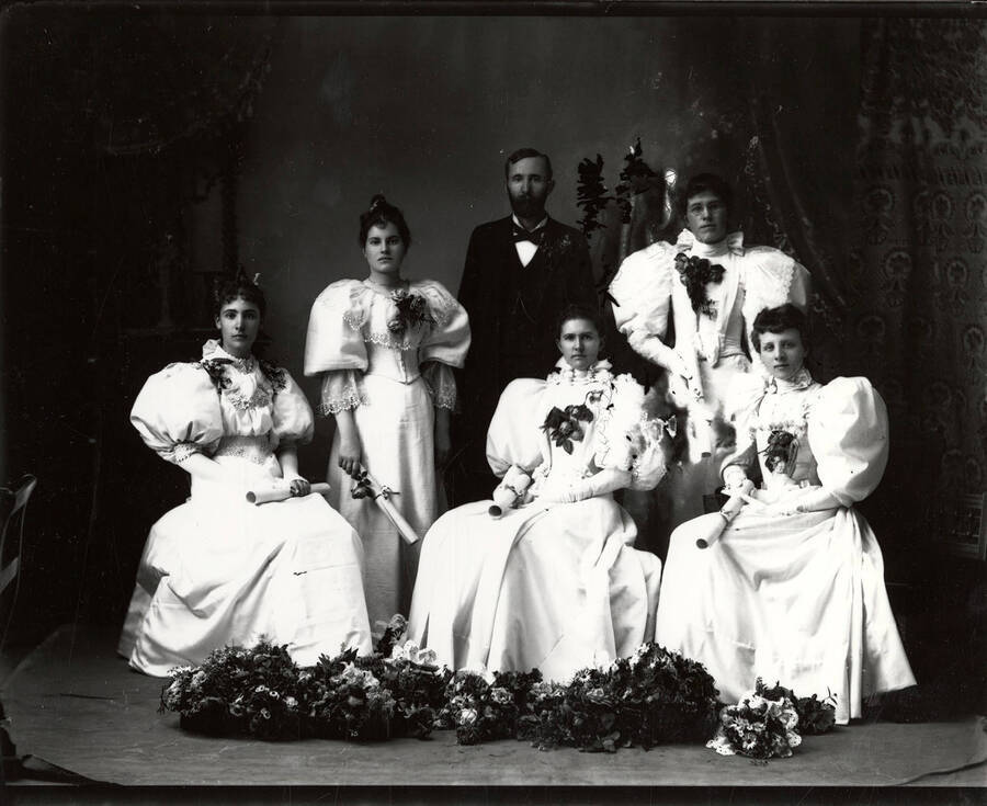 The 1895 graduating class of Wallace High School in Wallace, Idaho. l-r: Kate Baldwin, Myrta Howes, unidentified, Kate Hanley, Nina Hogan, Luneti Worstell.