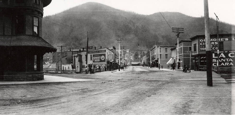 A street scene of buildings and people in Wallace, Idaho.