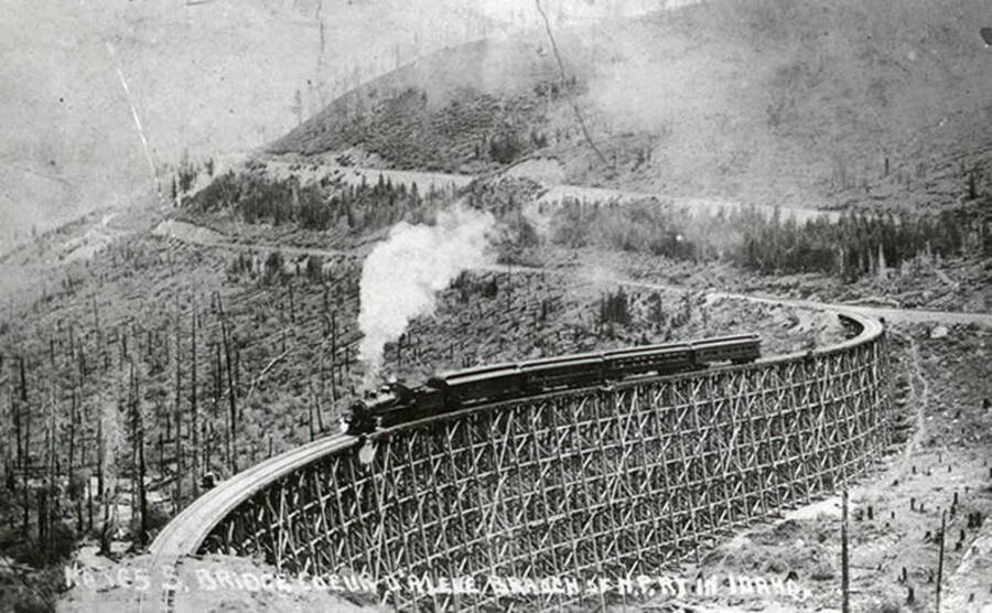 Train No. 165 on a curved trestle called the S bridge at the Coeur d'Alene Branch.