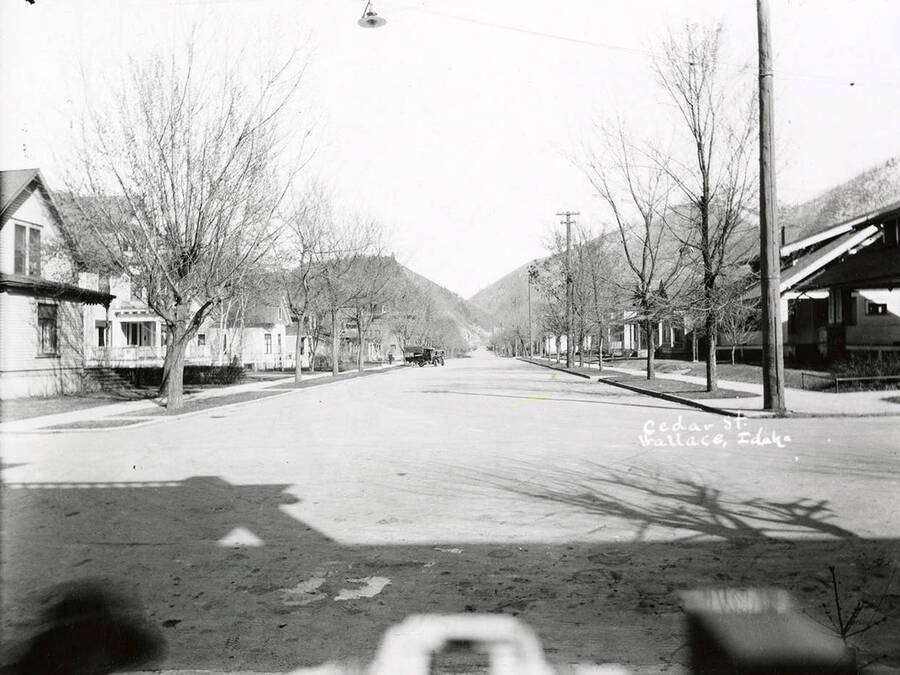View looking west down Cedar Street, with houses along the sides, in Wallace Idaho