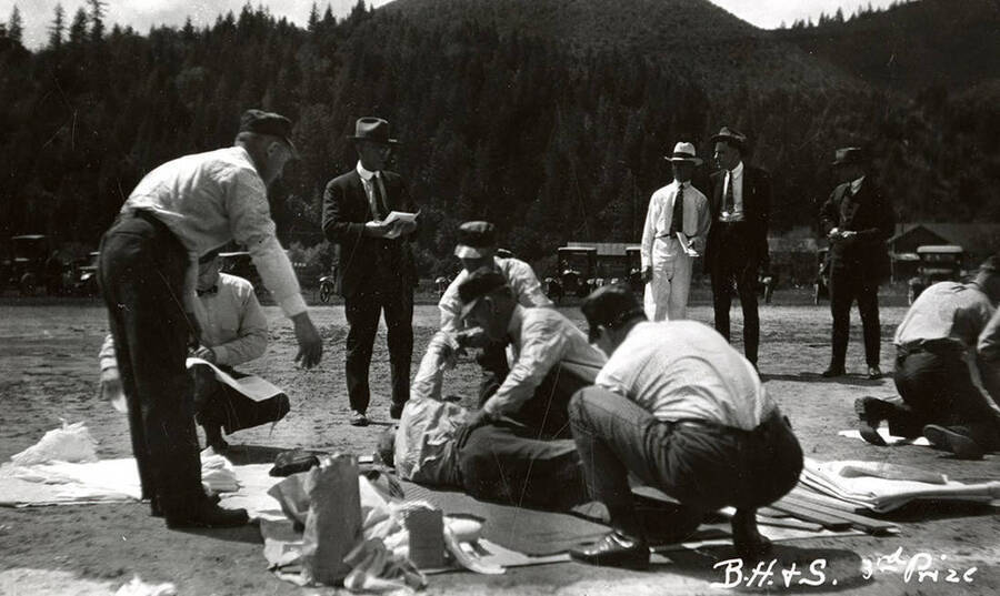The members of Bunker Hill & Sullivan team, who won third prize, performing first aid at the first aid contest in Mullan, Idaho.