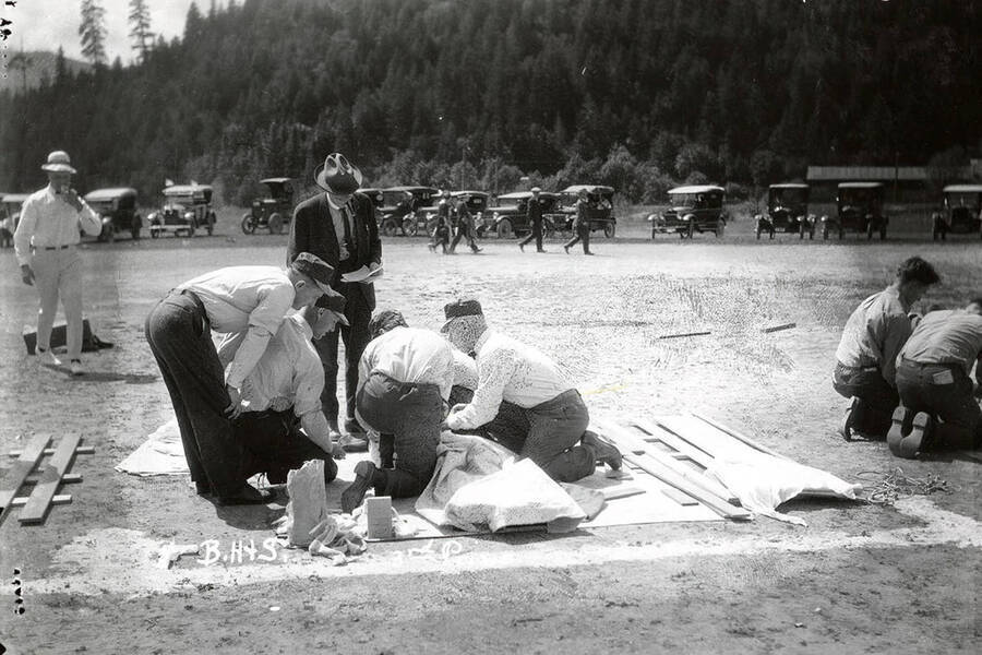 The members of Bunker Hill & Sullivan team, who won third prize, performing first aid at the first aid contest in Mullan, Idaho.