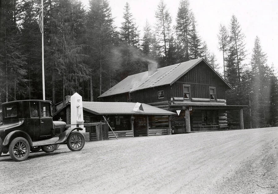 Exterior view of a building, with a car parked out front, at Burns Summit.