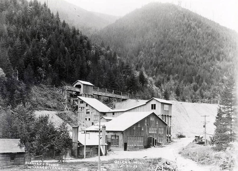 Exterior view of Galena Mill, with a few hills behind it, in Wallace, Idaho.