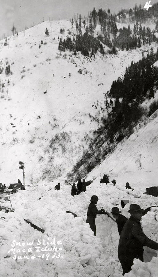 People shoveling snow after a snow slide in Mace, Idaho.