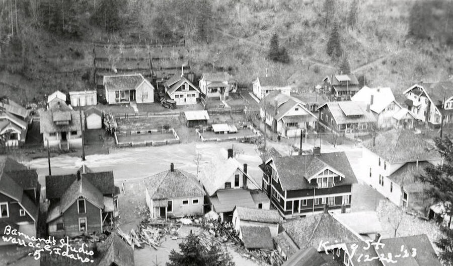 View of King Street during the Placer Creek flood in Wallace, Idaho. Houses line the street.