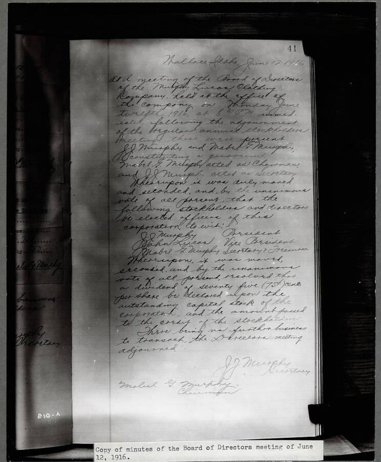 Photograph of handwritten meeting minutes from the board of directors of Murphy Lucas Clothing Co. Wallace, Idaho. According to the minutes, J.J. Murphy was elected president of the company, John Lucas, vice president and Mabel Murphy, secretary & treasurer.