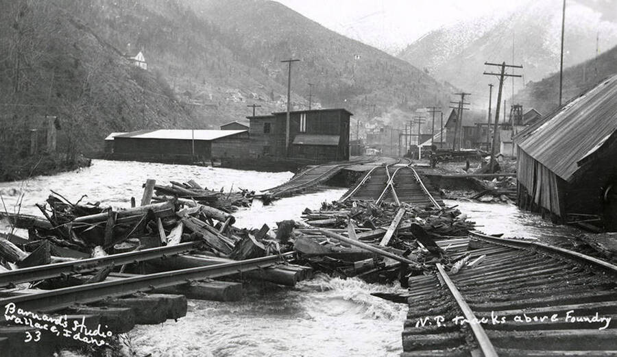 The Northern Pacific Railroad tracks above foundry during the Placer Creek flood in Wallace, Idaho.