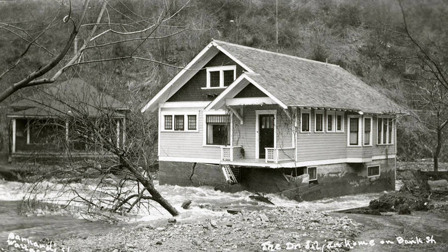 View of Dr. Siljan's home on Bank Street during the Placer Creek flood in Wallace, Idaho.