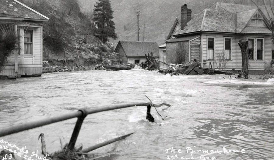 View of the Pfirman home on Second and Pine during the Placer Creek flood in Wallace, Idaho.