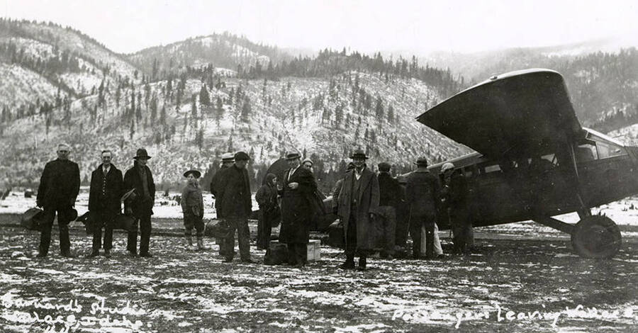 Airplane passengers leaving Wallace, Idaho during the Placer Creek flood.