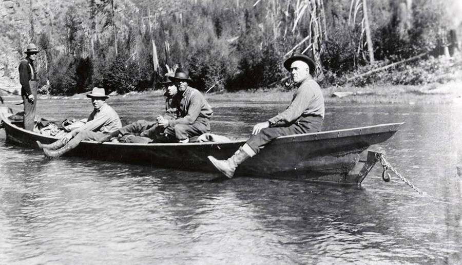 Men sitting in a boat and fishing on the North Fork.