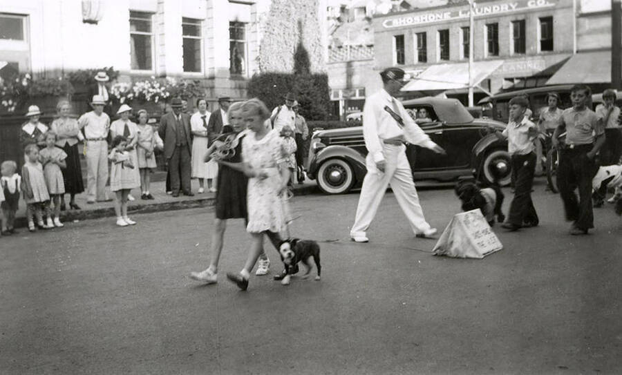 Children walking with their pets during the Veterans pet parade in Wallace, Idaho.