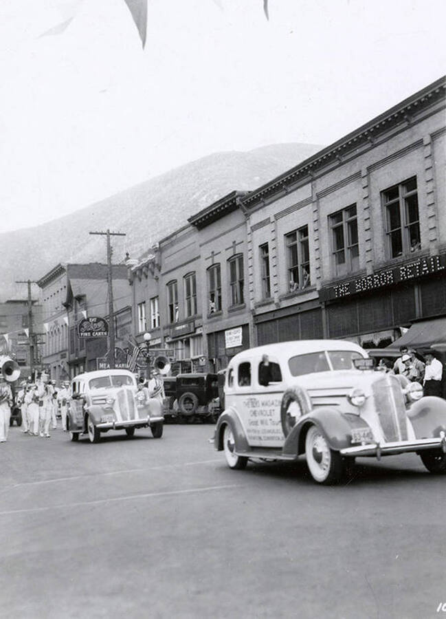 Cars driving in the Elks Roundup parade in Wallace, Idaho.