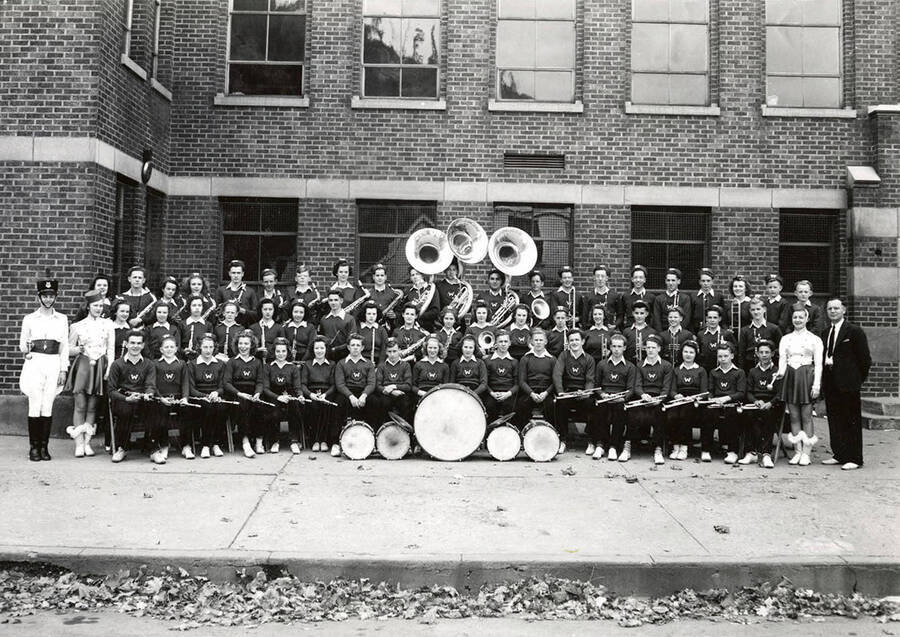 The Wallace High School Band posing as a group outside a building in Wallace, Idaho.