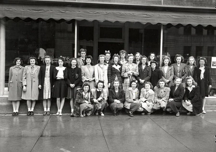 A school group posing together in front of Worstell Furniture Store in Wallace, Idaho.